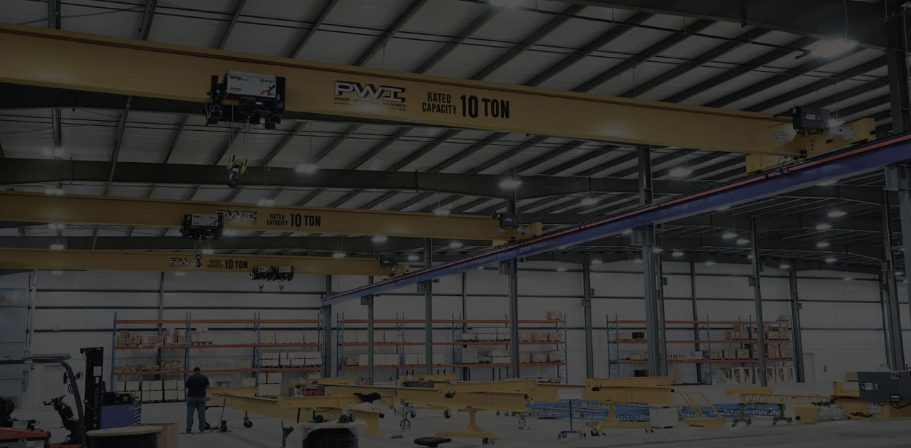 Overhead cranes in a fabrication warehouse