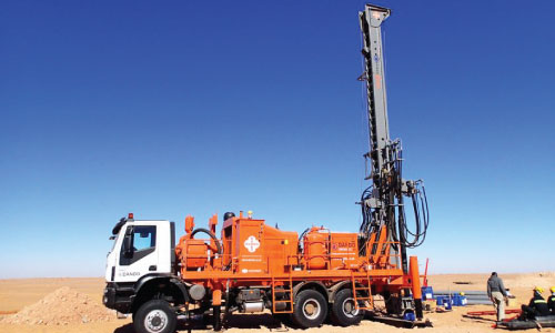 Drilling rig truck in desert terrain